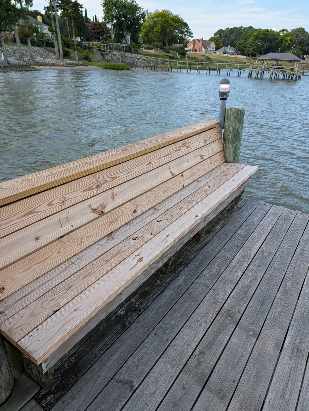 New wooden bench on an existing residential pier